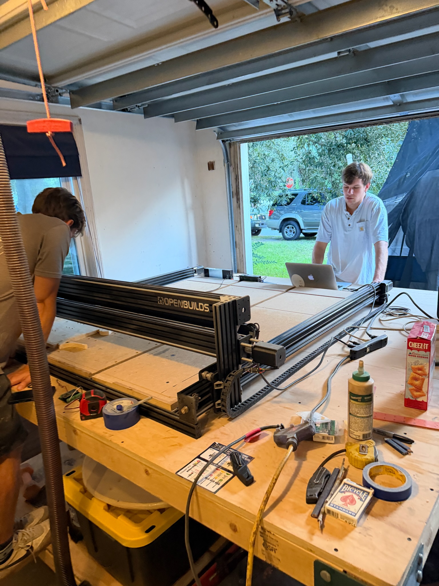 Two of us working around the CNC router in the garage.