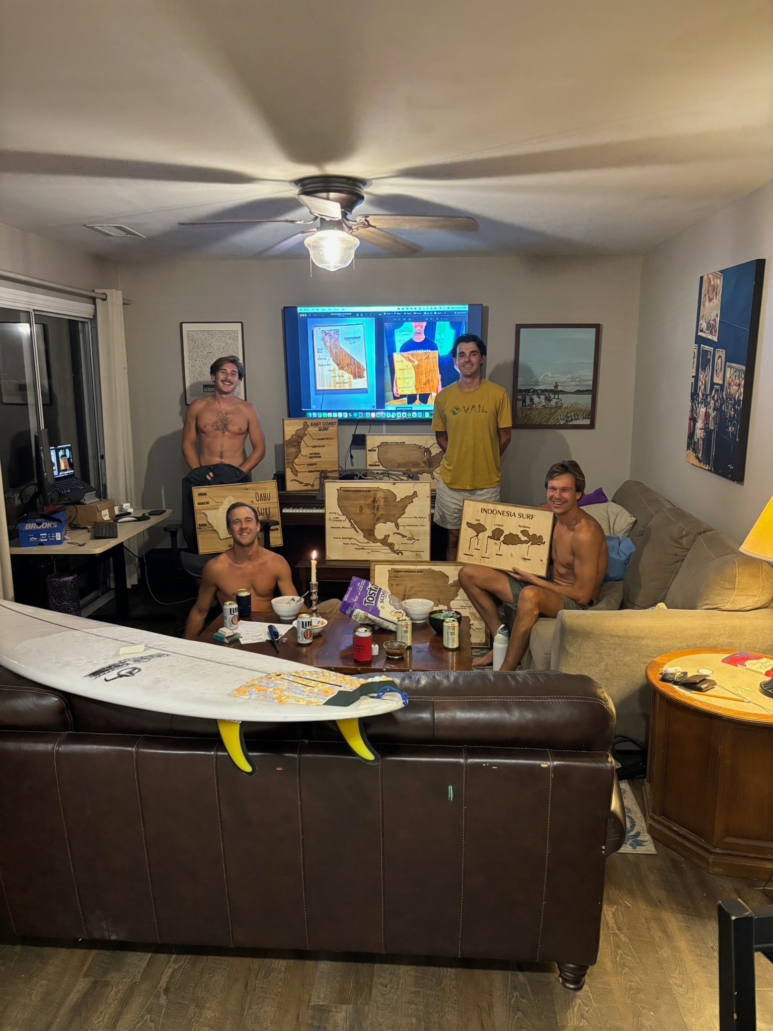 The four of us in the living room holding up our maps.